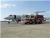 Fire Truck Next to Airplane
