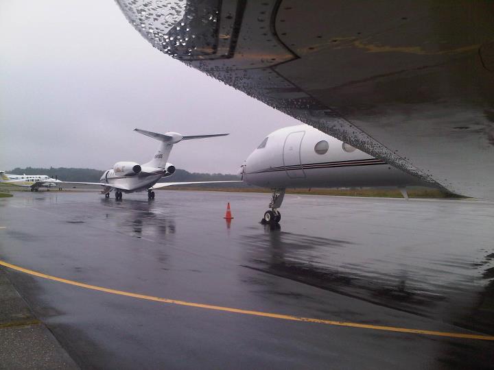Looking at Plane Tail From Under Airplane Wing